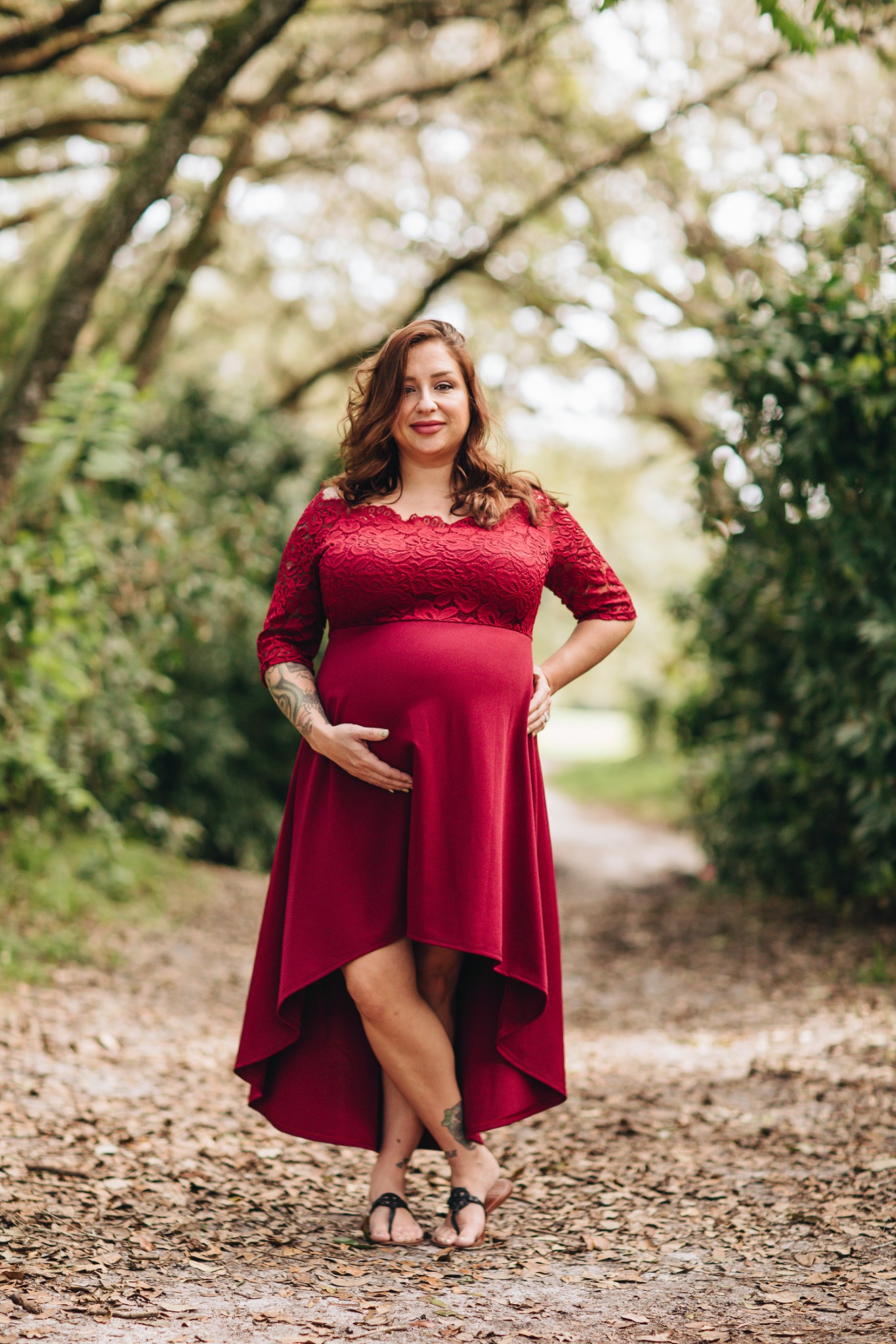 Carrie maternity photo under oak trees